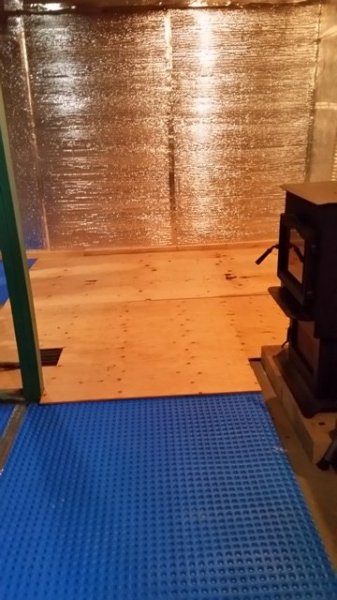 basement floor w plywood.jpg