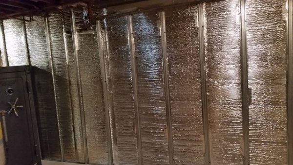 metal studs along wall to safe.jpg