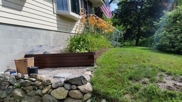 Restained timbers front flower bed.jpg