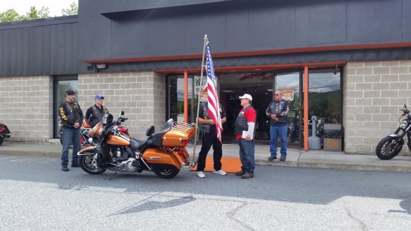 Blake handing off flag to Granite State Chapter.jpg