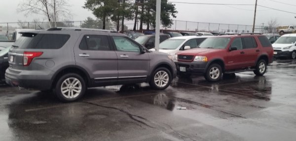 2004 and 2014 ford explorers facing 1.jpg