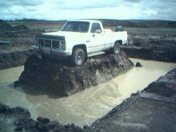 Guy with backhoe mad.jpg