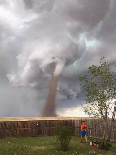 guy-mowing-lawn-with-tornado-coming-1.jpg