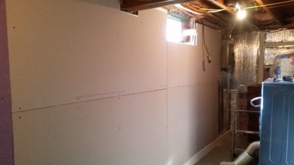 Wall mostly sheetrocked.jpg