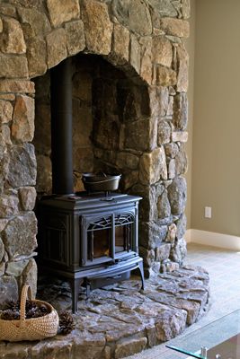 12dc2cfe8cebcd0704c0a2d531003fae--wood-stove-surround-rock-fireplaces.jpg
