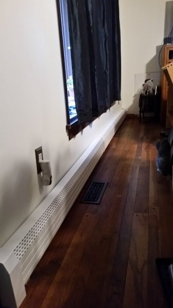 Living room long wall heater cover.jpg