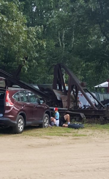 sitting on Grampa helping.jpg