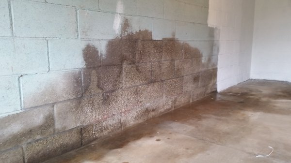 Garage wall before with outline of bike.jpg