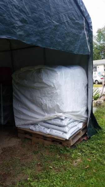 1 ton pellets in tent garage.jpg