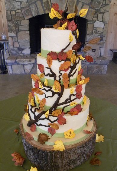 Five tier white tree theme wedding cake with branches and leaves and tree trunk.JPG