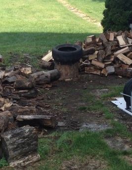 splitting stump with tire.JPG