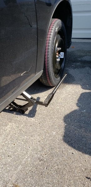 car tire with donut and jack stand.jpg