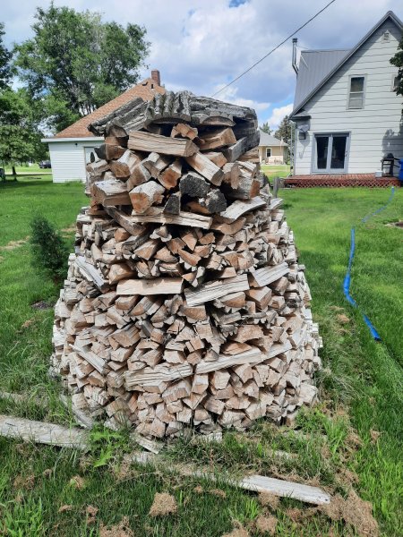 Build a holz hausen to dry firewood - Backwoods Home Magazine