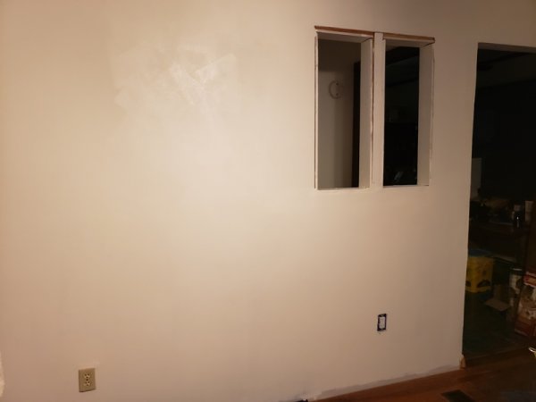 Living room wall 1-coat of paint.jpg