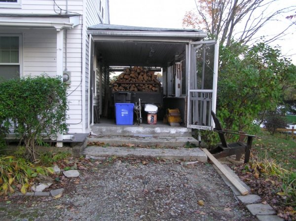 Wood and trailer on porch.jpg