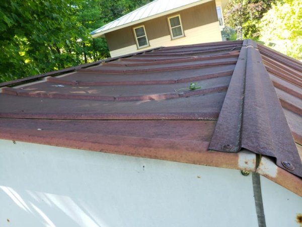 Roof dip of metal shed-tree side.jpg