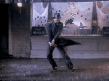 gene-kelly-singing-in-the-rain.gif
