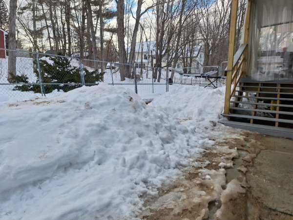 Snow mounds by back porch.jpg