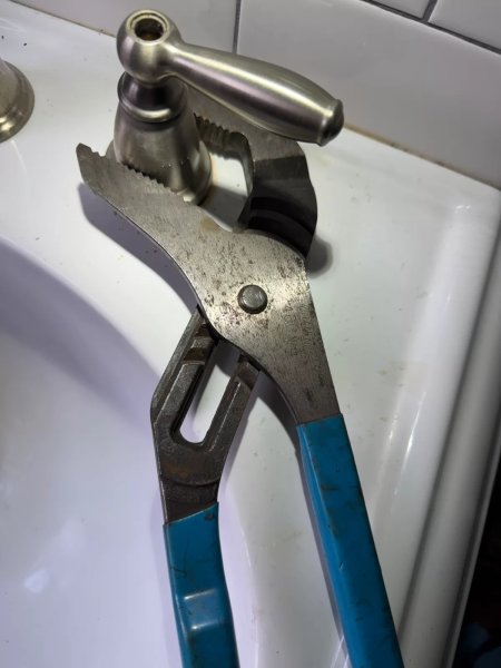 PedestalFaucetRep03-UnscrewingHandleBodyWithChannelLockPliers.jpg