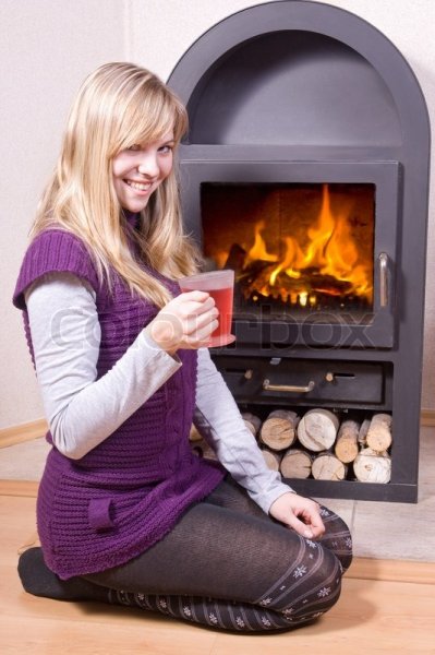 2783580-girl-drinking-tea-near-the-fireplace.jpg