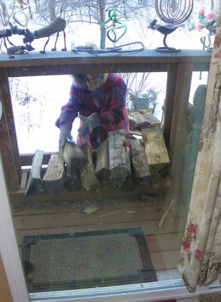 Judy filling wood rack-1.JPG