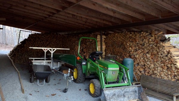 wood and tractor behind garage .jpg