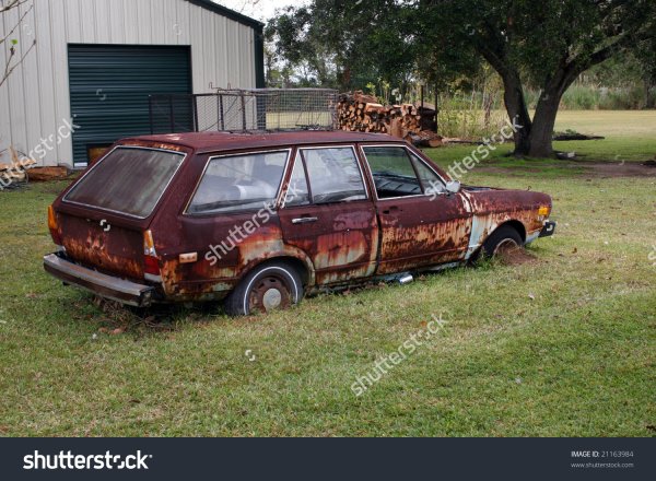 stock-photo-rusted-out-old-car-21163984.jpg