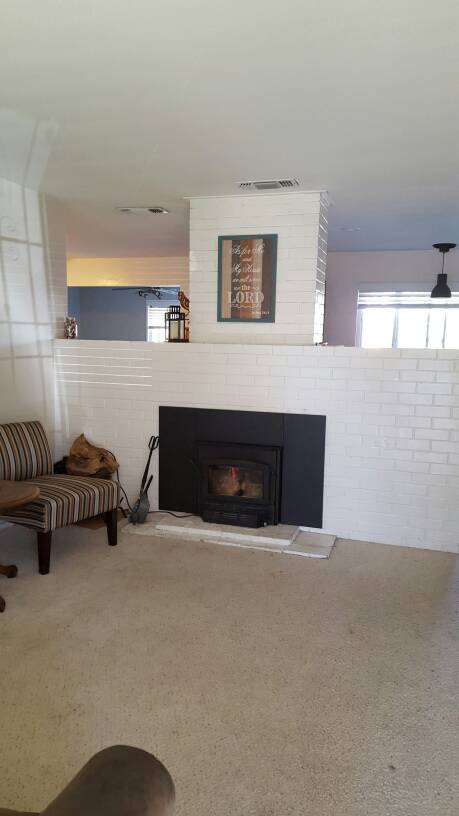 Insulation around old brick fireplace